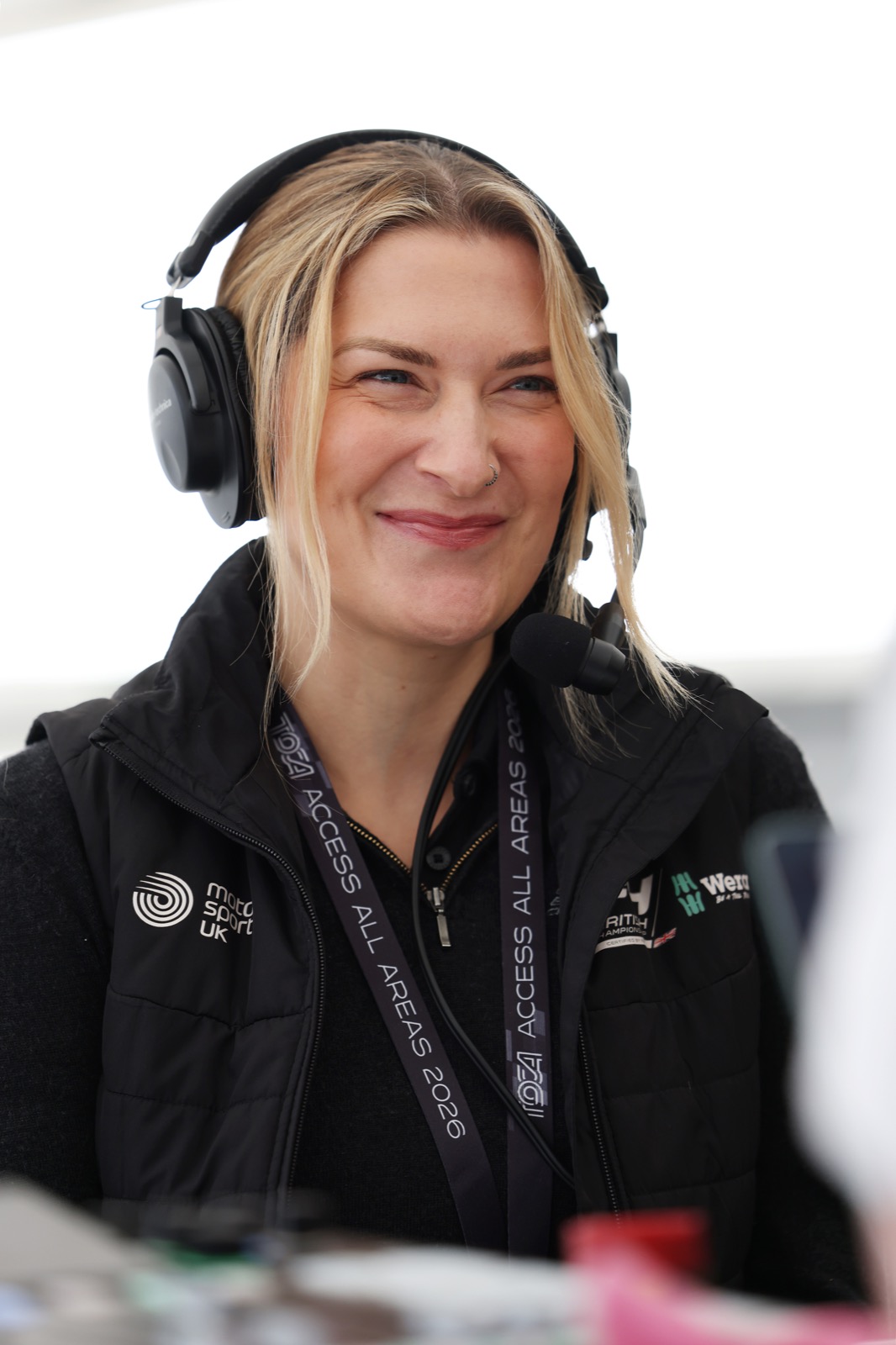 Eve Lake-Grange, Championship Manager for British F4, in the paddock wearing a headset