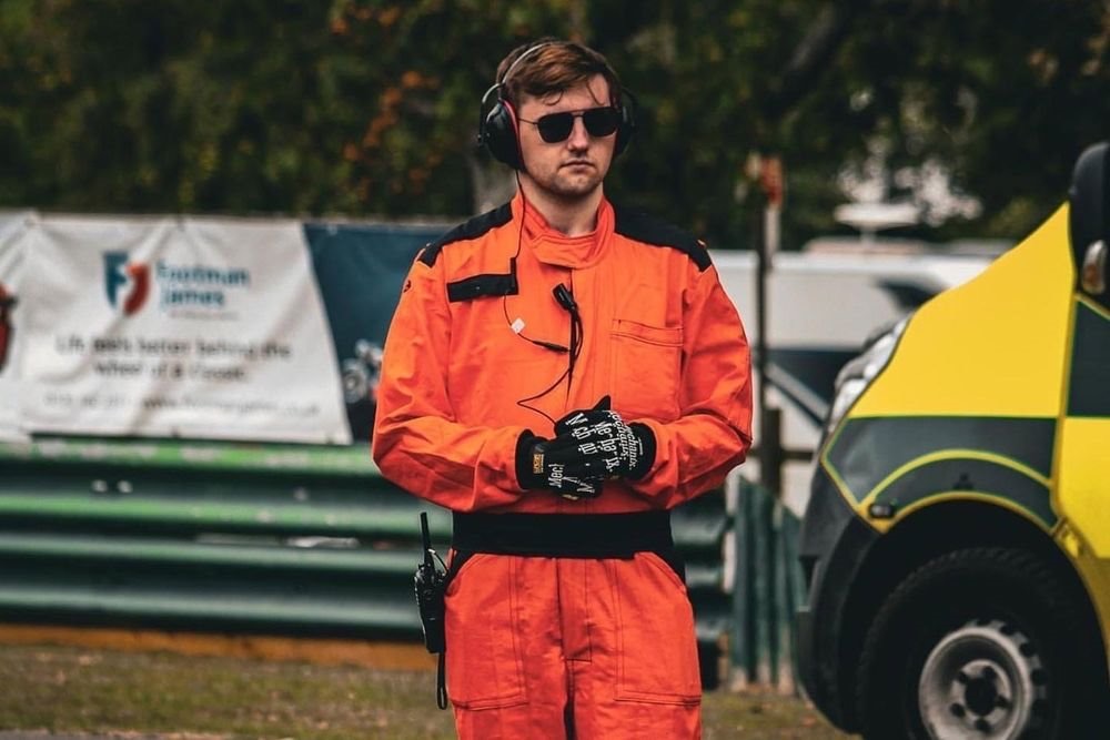Sam Walker in marshal overalls at a motorsport event